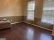 Dining room with hardwood floors and window blinds at 4870 Hairston Park Sq, Stone Mountain, GA 30083
