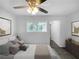 Virtually staged bedroom with a ceiling fan and en suite bathroom at 2653 Tilson Rd, Decatur, GA 30032