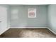 Bedroom with light green walls and neutral carpeting at 2653 Tilson Rd, Decatur, GA 30032