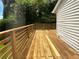 Large wooden deck with railings, overlooking a yard at 2653 Tilson Rd, Decatur, GA 30032