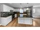 Modern kitchen with white cabinets, granite countertops and stainless steel appliances at 2653 Tilson Rd, Decatur, GA 30032