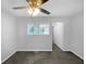 Spacious bedroom with ceiling fan and en-suite bathroom access at 2653 Tilson Rd, Decatur, GA 30032