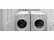 White washer and dryer in a small laundry room at 2653 Tilson Rd, Decatur, GA 30032
