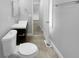 Updated bathroom with a toilet, vanity, and view of hallway at 2653 Tilson Rd, Decatur, GA 30032