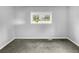 Simple bedroom with gray walls and neutral carpeting at 2653 Tilson Rd, Decatur, GA 30032
