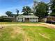 Newly painted home with a wooden deck and landscaped yard at 2653 Tilson Rd, Decatur, GA 30032