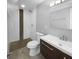 Modern bathroom with walk-in shower, updated vanity, and tile flooring at 2653 Tilson Rd, Decatur, GA 30032