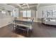 Dining room with wood table, gray chairs and bench, and coffered ceiling at 437 Livingston Pt, Acworth, GA 30102