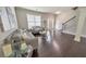 Living room with hardwood floors, gray sofa and love seat, and coffee table at 437 Livingston Pt, Acworth, GA 30102