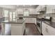 Kitchen with white cabinets, granite countertops, and stainless steel appliances at 437 Livingston Pt, Acworth, GA 30102