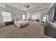 Large main bedroom with a king-size bed and sitting area at 437 Livingston Pt, Acworth, GA 30102