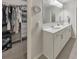 Double vanity bathroom with walk-in closet access at 437 Livingston Pt, Acworth, GA 30102