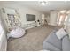Bright playroom featuring built-in shelving and a comfy seating area at 437 Livingston Pt, Acworth, GA 30102