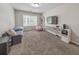 Spacious playroom with TV, seating, and ample storage at 437 Livingston Pt, Acworth, GA 30102