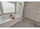 Relaxing bathroom with soaking tub and walk-in shower at 437 Livingston Pt, Acworth, GA 30102