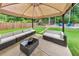 Covered patio with seating and fire pit at 437 Livingston Pt, Acworth, GA 30102