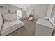 Charming bedroom with a queen bed and a chic chair at 437 Livingston Pt, Acworth, GA 30102