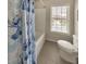 Charming bathroom with a shower/tub and window at 437 Livingston Pt, Acworth, GA 30102