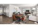 Open concept dining area with a wood table and four leather chairs at 675 Highgrove Way, Dallas, GA 30157