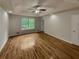 Large main bedroom with hardwood floors and ceiling fan at 315 Cypress Ln, Stockbridge, GA 30281