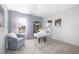 Home office with a desk, chair, and calming decor. Large window provides natural light at 12000 Conrad Cir, Hampton, GA 30228