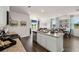 Open concept kitchen with island and stainless steel appliances at 12000 Conrad Cir, Hampton, GA 30228