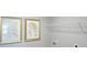 Laundry room with wire shelving and gold framed botanical prints at 12000 Conrad Cir, Hampton, GA 30228