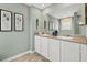 Bathroom with double vanity, large mirror, and shower at 12000 Conrad Cir, Hampton, GA 30228