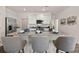 Kitchen island with granite countertops and seating at 12000 Conrad Cir, Hampton, GA 30228