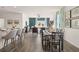 Open dining area with hardwood floors and modern table set at 12000 Conrad Cir, Hampton, GA 30228