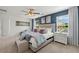 Spacious main bedroom with ceiling fan and large windows at 12000 Conrad Cir, Hampton, GA 30228