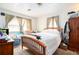 Bedroom with wooden bed frame and dresser at , Atlanta, GA 30318