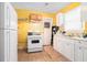Small kitchen with white cabinets and yellow walls at , Atlanta, GA 30318