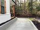 Driveway leading to the home, bordered by landscaping and a retaining wall at 408 Autry St, Norcross, GA 30071