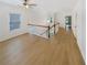 Spacious loft area with hardwood floors and a view to the floor below at 4795 Hastings Ter, Alpharetta, GA 30005