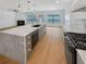 Large kitchen island with marble countertop, farmhouse sink, and ample seating at 4795 Hastings Ter, Alpharetta, GA 30005