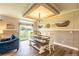 Bright dining area with wood table, bench, and access to backyard at 1107 N Van Wert Rd, Villa Rica, GA 30180
