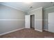 Well-lit bedroom featuring carpet, a closet, and an ensuite bathroom at 1107 N Van Wert Rd, Villa Rica, GA 30180
