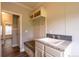 Convenient laundry area with built-in storage and a utility sink at 1107 N Van Wert Rd, Villa Rica, GA 30180