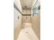 Large walk-in shower with neutral tile and built-in seat at 1107 N Van Wert Rd, Villa Rica, GA 30180