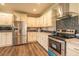 Eat-in kitchen with stainless steel appliances and granite countertops at 1107 N Van Wert Rd, Villa Rica, GA 30180