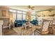 Bright living room with comfy blue sofas, a coffee table, and large windows at 1107 N Van Wert Rd, Villa Rica, GA 30180