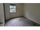Empty bedroom with a window and carpeted floor at 2900 Kevin Ln, Jonesboro, GA 30236