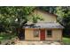 Two-story house with a yellow exterior and red door at 2900 Kevin Ln, Jonesboro, GA 30236