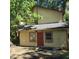 Ranch style home with a red door and mature trees at 2900 Kevin Ln, Jonesboro, GA 30236