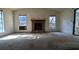 Living room with fireplace and large windows at 2900 Kevin Ln, Jonesboro, GA 30236