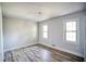 Bright bedroom featuring hardwood floors and two windows at 2933 Margaret Mitchell Nw Ct, Atlanta, GA 30327