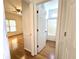 Bathroom with tub shower, wood floors, and white vanity at 3070 Ridge Oak Dr, Suwanee, GA 30024