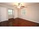Spacious bedroom with hardwood floors and ample natural light at 1715 Moores Mill Rd, Atlanta, GA 30318
