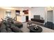 Open and bright living area with hardwood floors and kitchen access at 1715 Moores Mill Rd, Atlanta, GA 30318